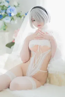 Woman in a white linger and a veil