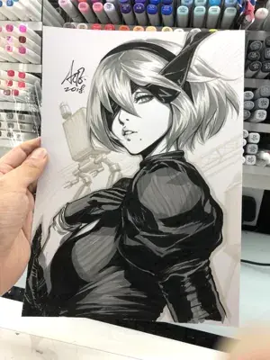 Grayscale drawing of 2B from NieR:Automata held up with art supplies in the background.