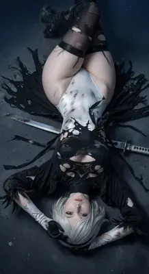 2B from Nier Automata battle-worn on the ground - digital artwork showing android warrior in signature outfit