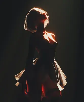 Silhouetted figure resembling A2 from NieR:Automata in a dramatic pose.