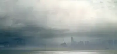 Artwork featuring the post-apocalyptic, fog-covered urban ruins from the game Nier Automata