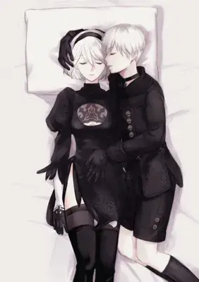 Two people laying in bed with their backs