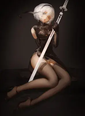 Thumbnail of Woman in a black dress holding a sword - Nier Art