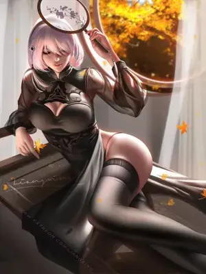 Woman in a black dress sitting on a table