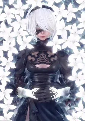 Woman in a black dress standing in front of white flowers
